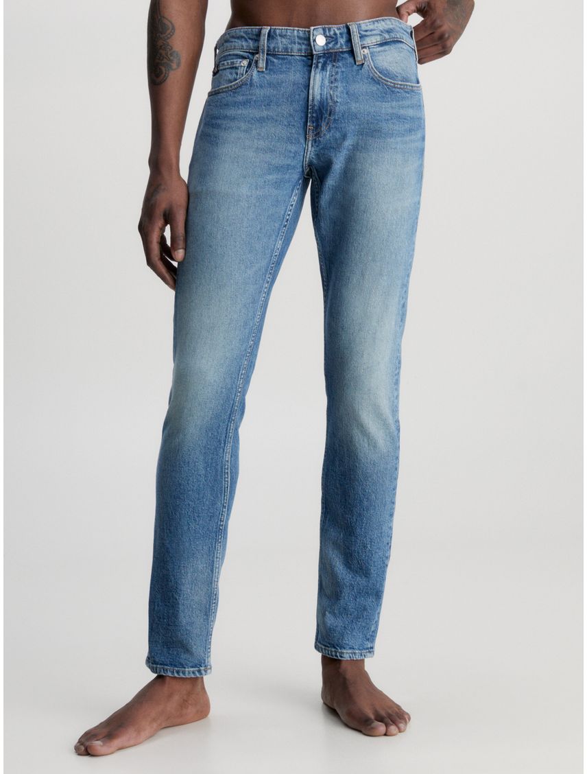 Jeans slim con efecto desgastado