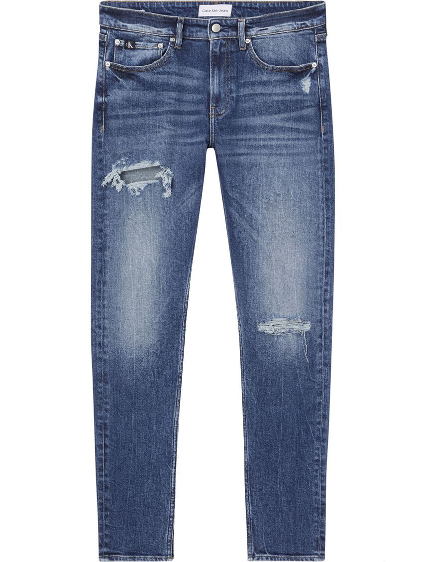 Jeans slim tapered con rotos