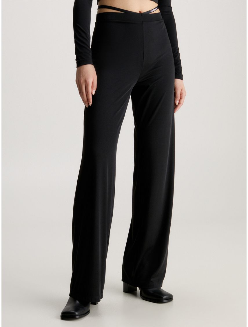 Pantalones de punto acampanados con detalle de tiras