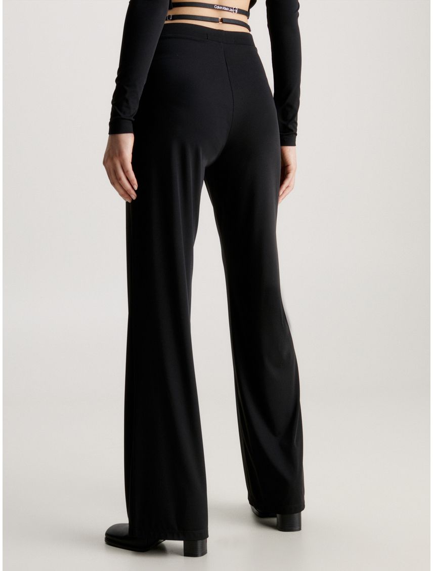 Pantalones de punto acampanados con detalle de tiras