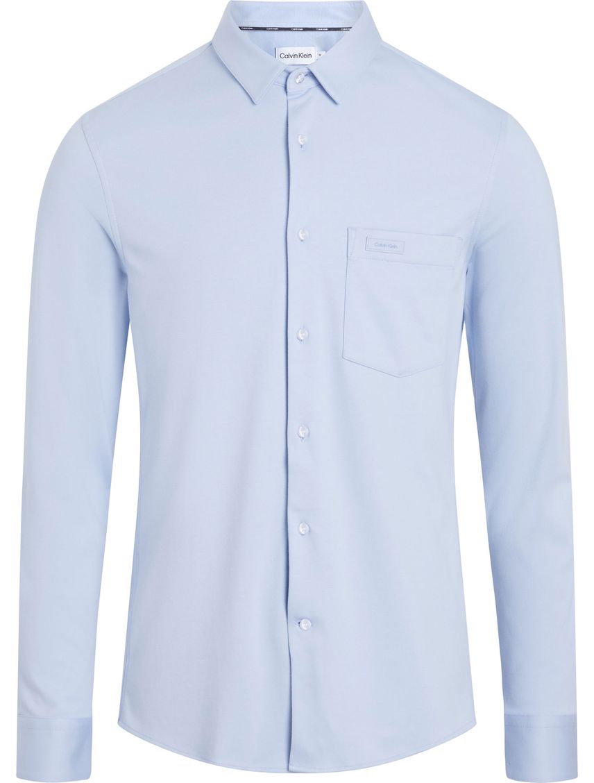 Camisa slim manga larga con bolsillo